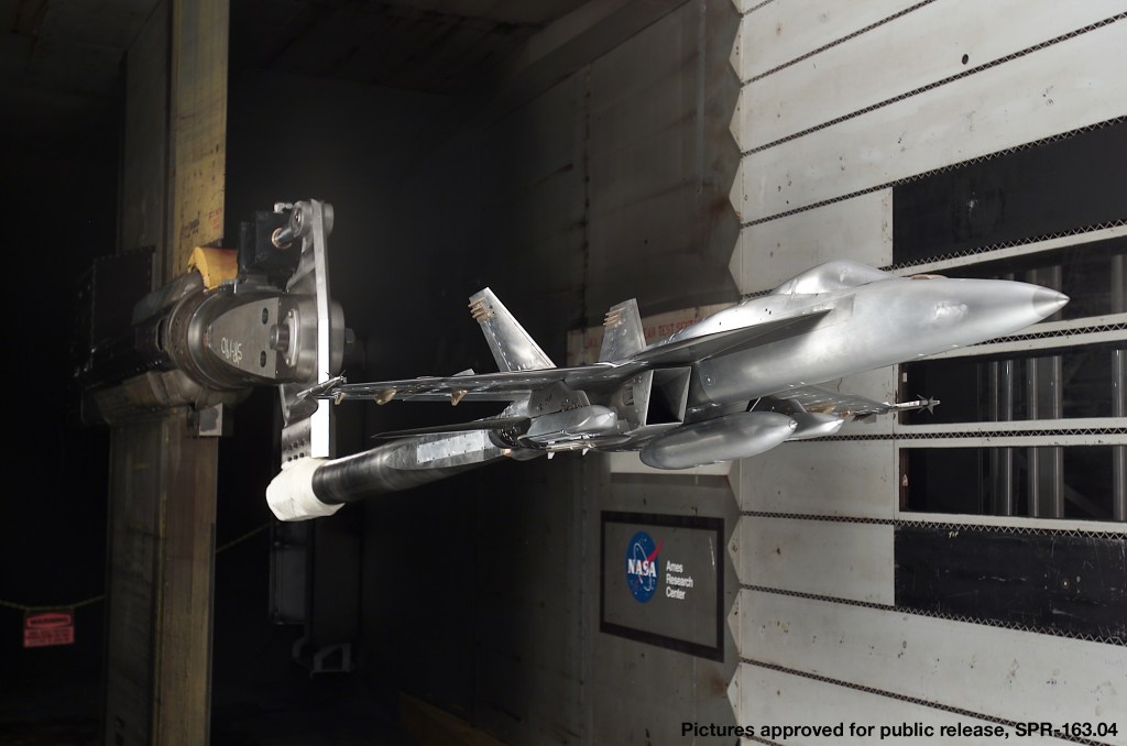 model of F-18 jet mounted in wind tunnel