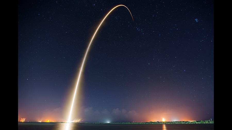 The Falcon 9 rocket with the Dragon cargo craft atop is pictured during a nighttime launch Sept. 21, 2014, from Cape Canaveral Air Force Station, Florida. Credit: SpaceX