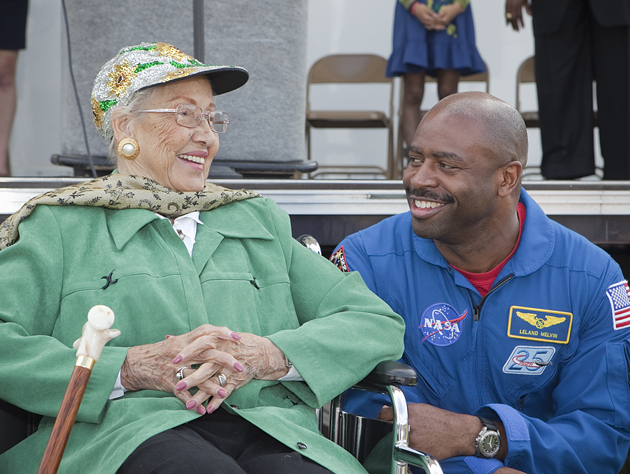 Katherine Johnson speaks with astronaut Leland Melvin during a NASA STEM education event.