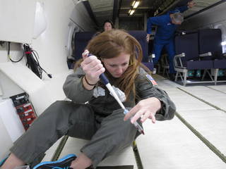 NASA immunologist and co-first author Hawley Kunz conducts a cell isolation test in simulated microgravity on a parabolic flight