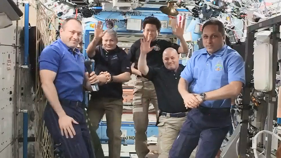 Expedition 54 Commander Alexander Misurkin, far left, hands over command of the space station to Anton Shkaplerov, far right.