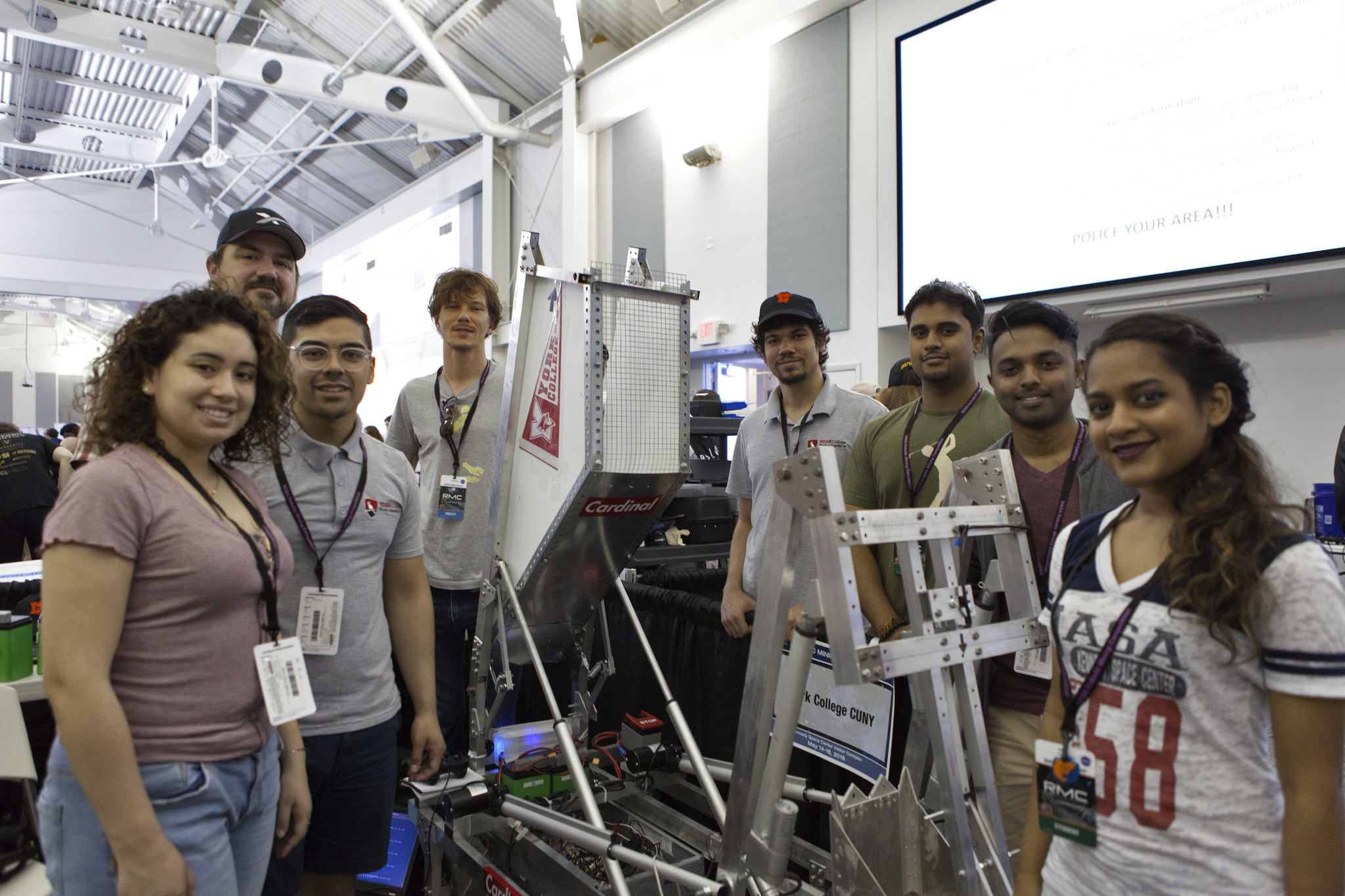 Team members from York College CUNY are with their robot miner in the RobotPits.