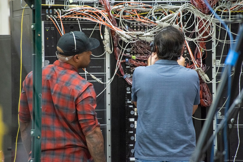 Eric Sinks, left, and Ron Haraguchi work through a challenge with the wiring from the Passive Aeroelastic Tailored wing.