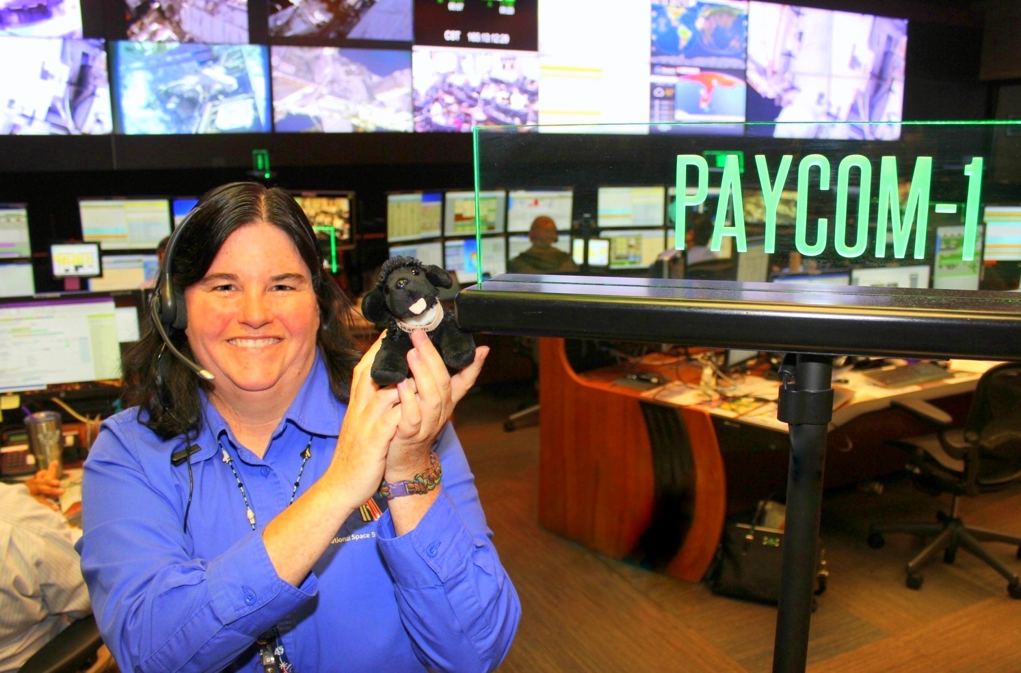 Inside the Payload Operations Integration Center, PAYCOM console operator Penny Pettigrew highlights the importance of teamwork.
