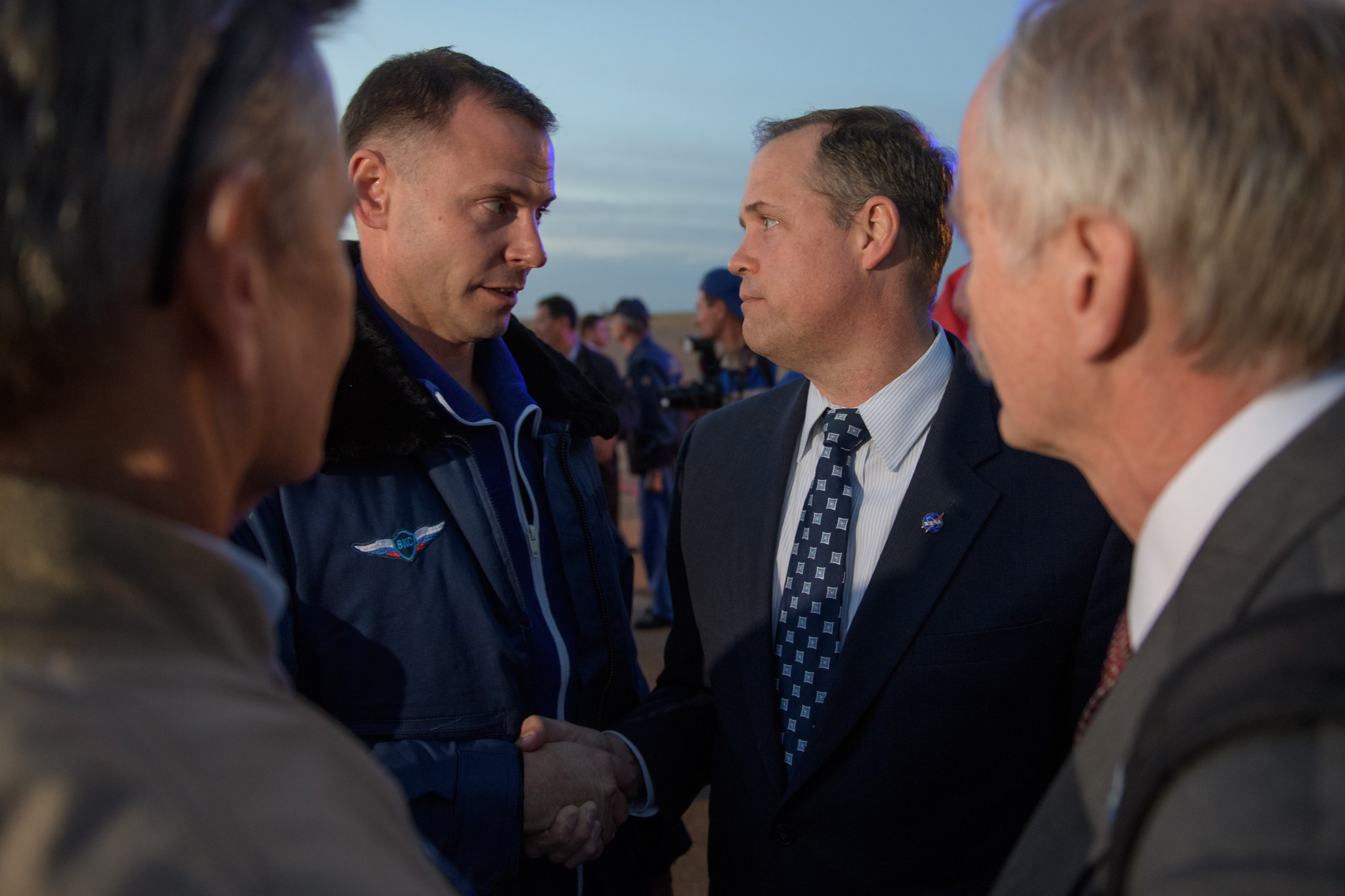 NASA Administrator shakes hands with astronaut Nick Hague