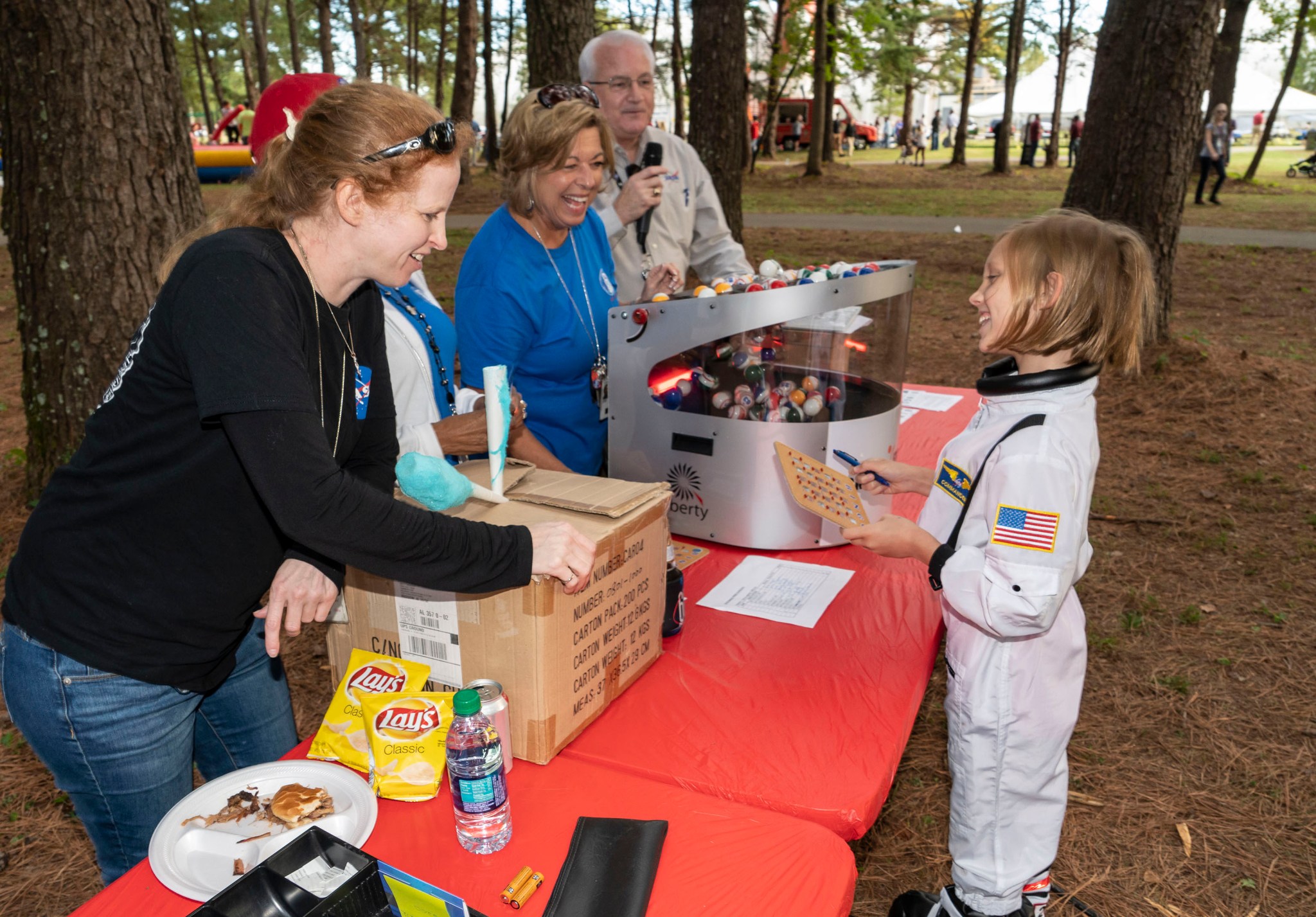 A future astronaut turns in her winning bingo card at Marshall's 2018 Fall Festival Oct. 18.