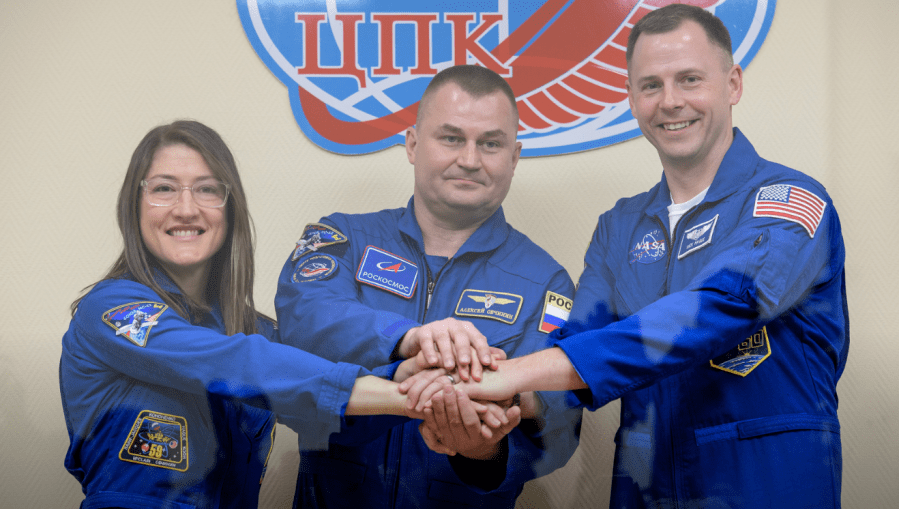 From left, Expedition 59 crew members Christina Koch, Alexey Ovchinin and Nick Hague show solidarity before their upcoming launch from Baikonur, Kazakhstan.