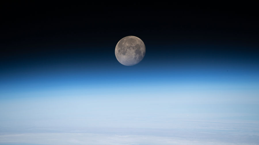 The moon is photographed in its waning gibbous phase