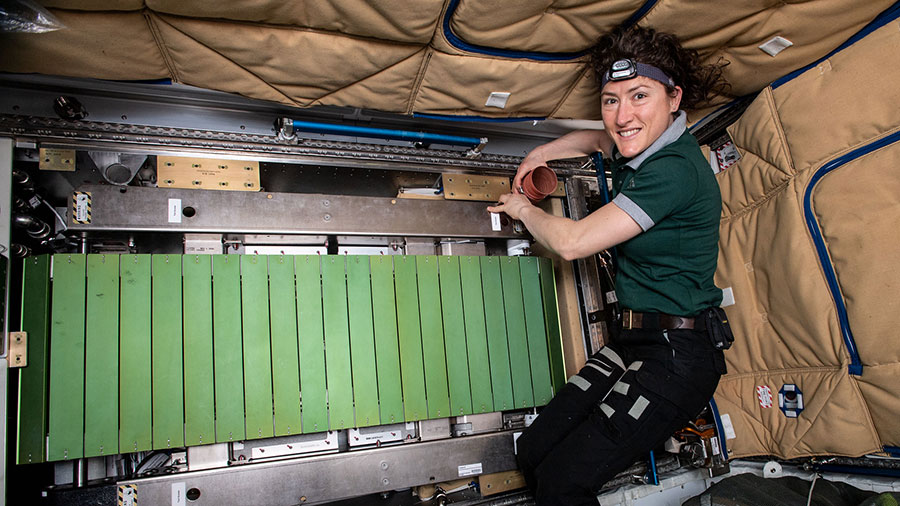 NASA astronaut Christina Koch works on the COLBERT treadmill