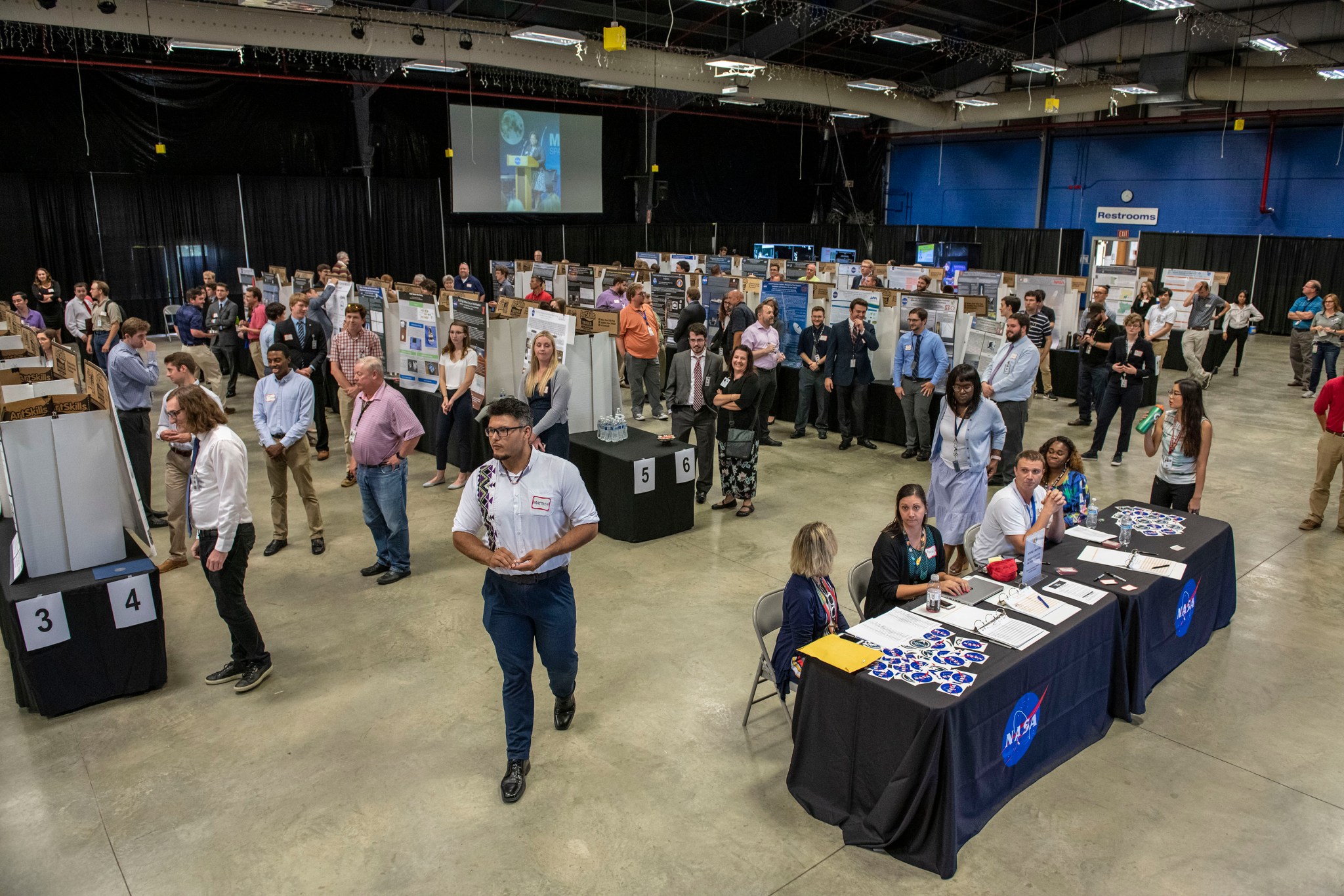 Summer interns at NASA's Marshall Space Flight Center display posters representing their completed NASA projects.