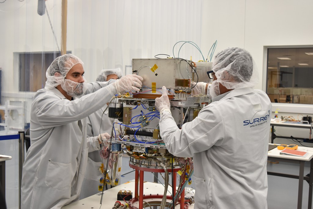 Employees working on NASA's Deep Space Atomic Clock