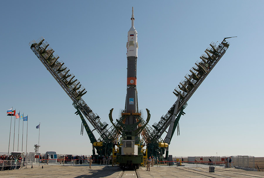 The gantry arms close around the Soyuz MS-15 rocket