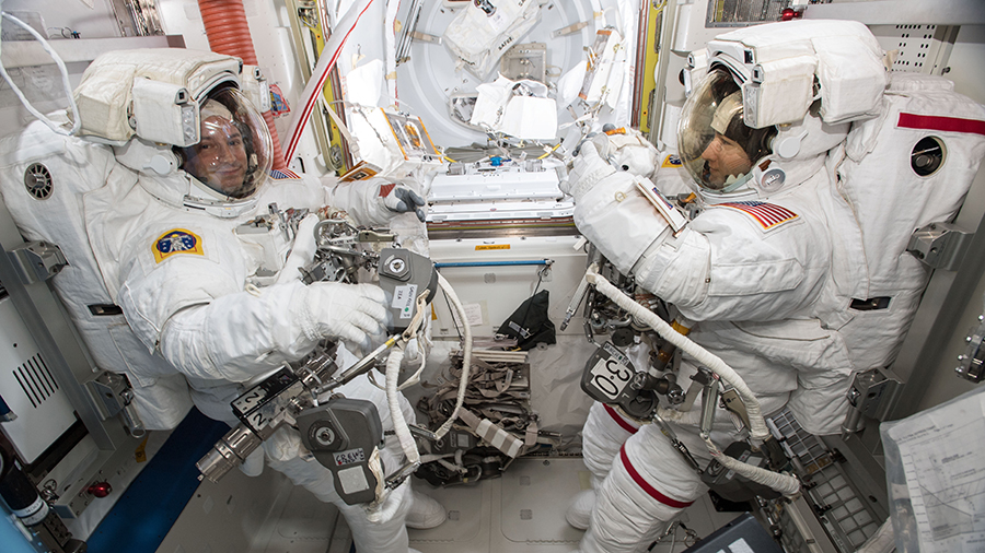 NASA astronauts Andrew Morgan (left) and Christina Koch (right) are suited up in U.S. spacesuits inside the Quest airlock for the first of five planned spacewalks that took place on Oct. 6, 2019. Image Credit: NASA