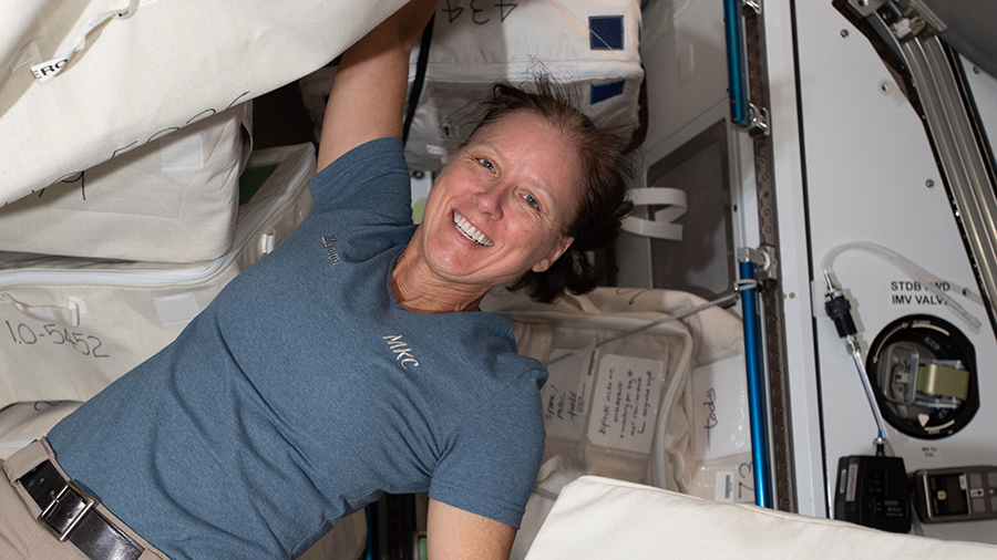 NASA astronaut Shannon Walker unpacks hardware inside the Quest airlock where U.S. spacewalks are staged.