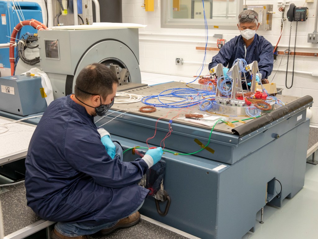 SCALPSS team members prepare the cameras and data storage unit for vibration testing.