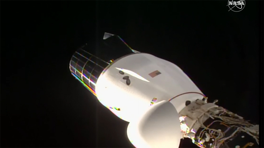 The SpaceX Cargo Dragon vehicle is pictured docked to the Harmony module's space-facing international docking adapter. Credit: NASA TV