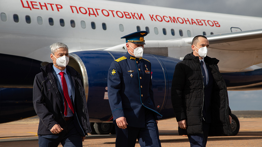 (From left) Expedition 65 crew members Mark Vande Hei, Oleg Novitskiy and Pyotr Dubrov, arrive for final launch preparations at the Baikonur Cosmodrome in Kazakhstan.