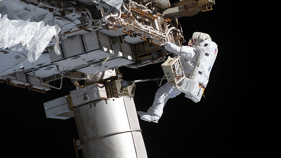 Expedition 64 Flight Engineer Victor Glover works during a spacewalk on Jan. 27, 2021 to set up the space station for future solar array upgrades.