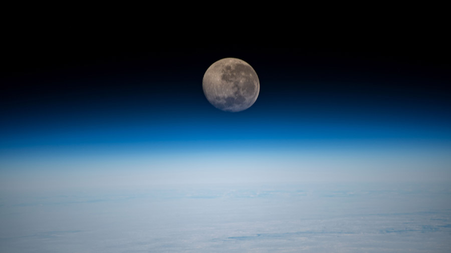 A waning gibbous Moon is pictured above the Earth's horizon as the space station orbited 269 miles above the Atlantic Ocean.