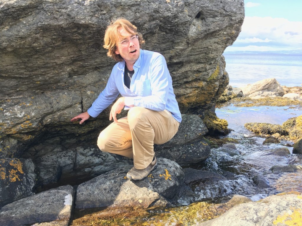 Tom Bristow in front of a rock