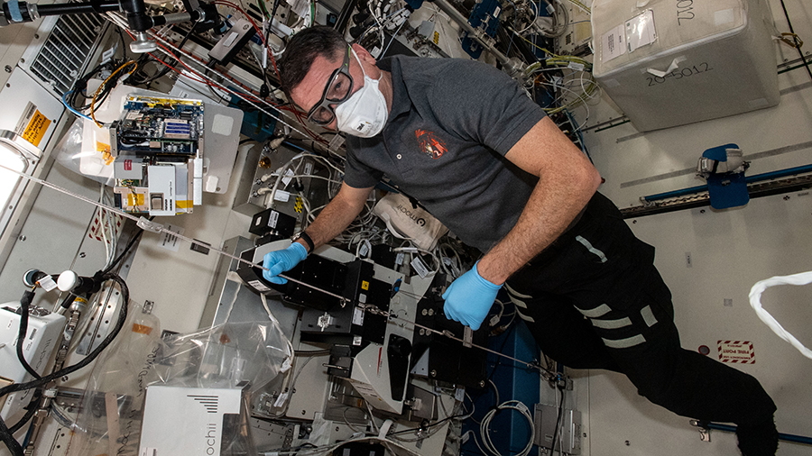 Astronaut Shane Kimbrough works on the Mochii miniature electron microscope to support spectroscopic investigations aboard the space station.