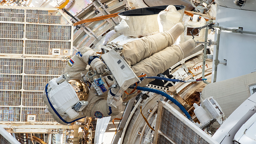 Russian spacewalker Pyotr Dubrov is pictured on Sept. 3 outfitting the Nauka multipurpose laboratory module with ethernet cables, power cables and handrails.