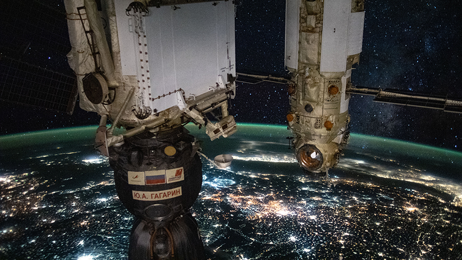 Russia's Soyuz MS-18 crew ship and the Nauka multipurpose laboratory module are pictured 264 miles above the city lights of eastern Europe.