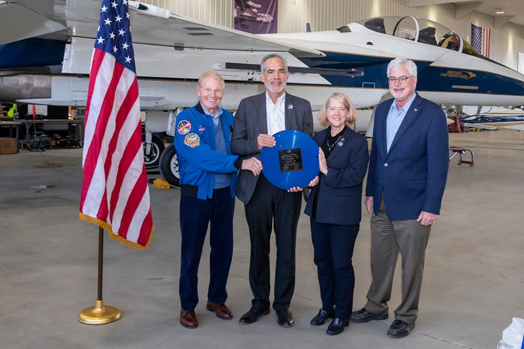 NASA Administrator Bill Nelson, from left, NASA Armstrong Flight Research Center Director David McBride, NASA Deputy Administrator Pam Melroy, and NASA Armstrong Deputy Center Director Patrick Stoliker, display the lid to a time capsule on Oct. 13.