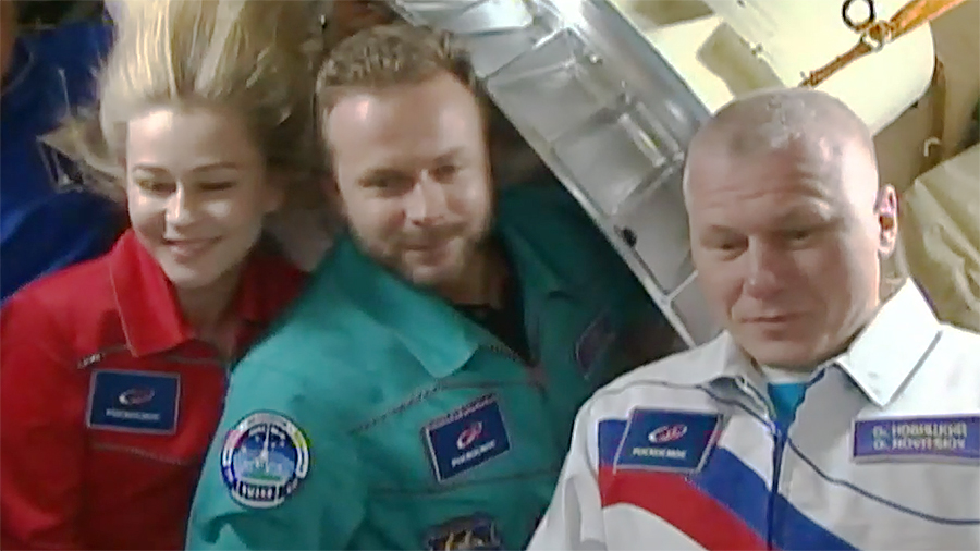 (From left) Spaceflight participants Yulia Peresild and Klim Shipenko and Roscosmos cosmonaut Oleg Novitskiy are pictured moments before entering the Soyuz MS-18 crew ship.