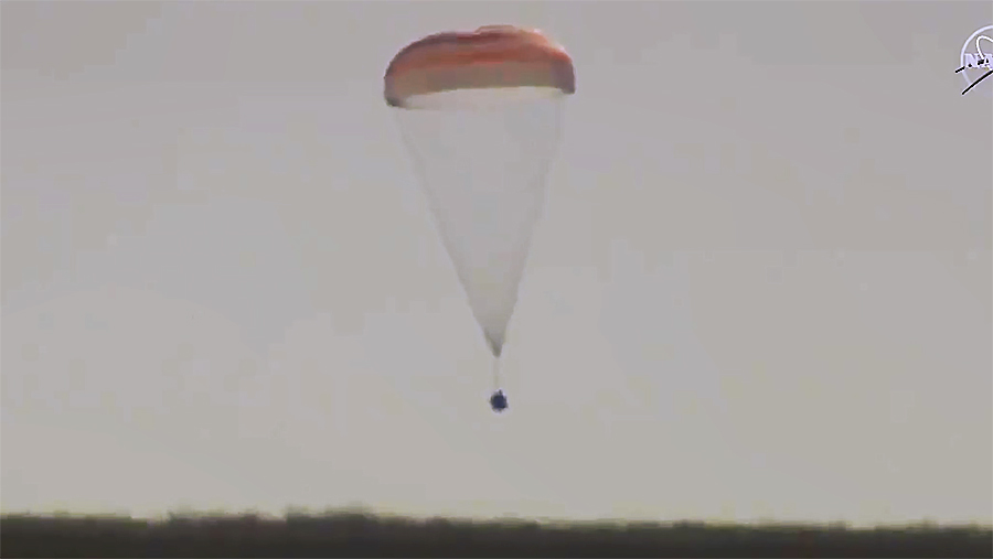 The Soyuz MS-18 crew ship with three Russian crew mates is pictured just moments from landing in the steppe of Kazakhstan.