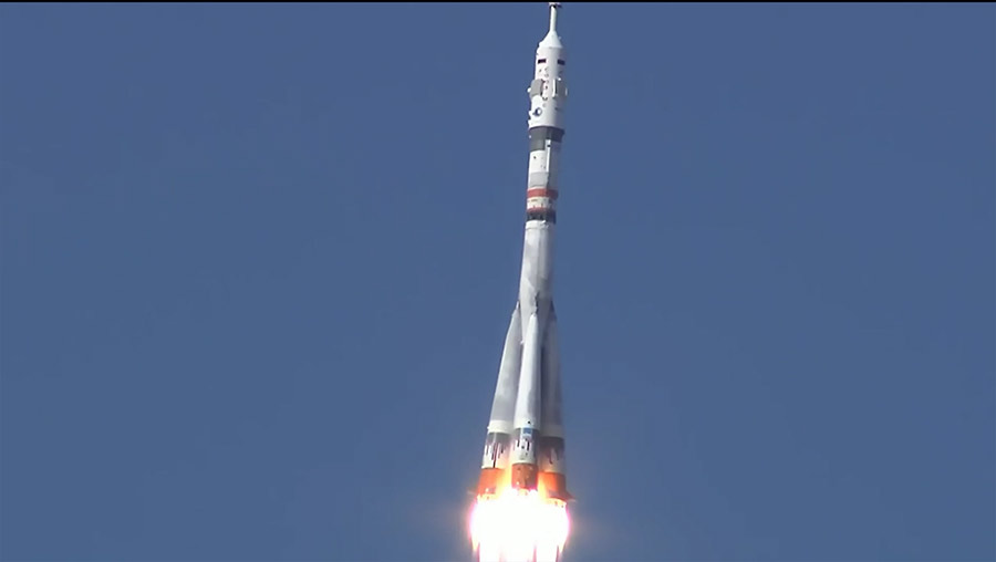 The Soyuz MS-19 rocket with three Russian crewmates aboard ascends into space shortly after launching under clear blues skies in Kazakhstan.