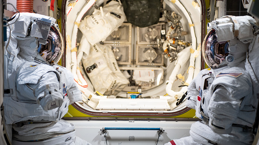 A pair of U.S. spacesuits that will be worn by NASA astronauts Thomas Marshburn and Kayla Barron are pictured in the station's Quest airlock.