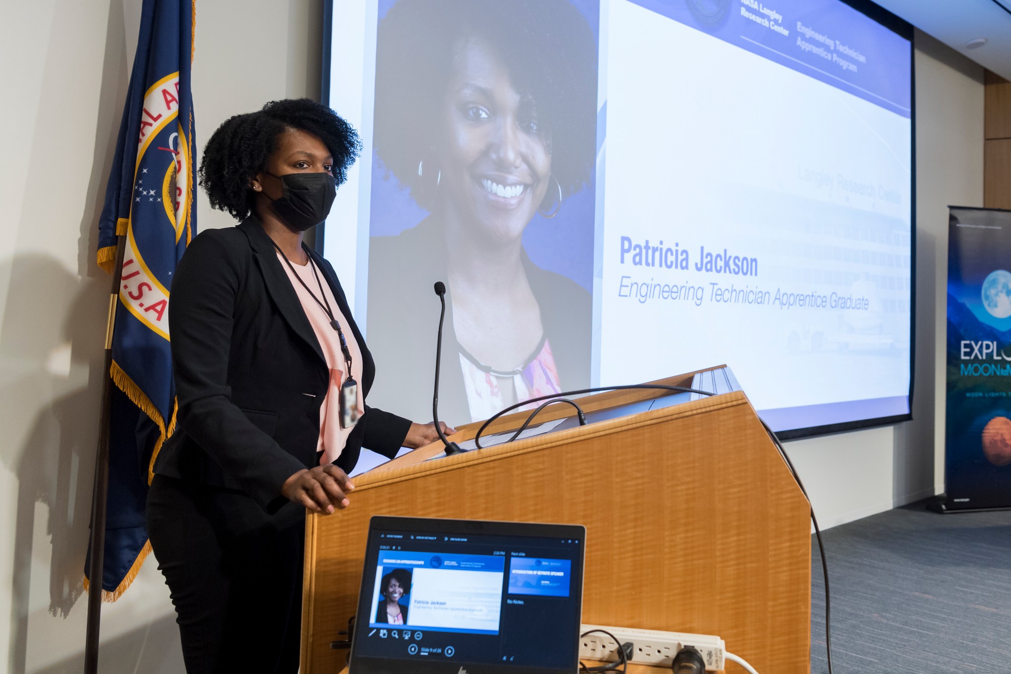 NASA’s Langley Research Center Engineering Technician Apprentice Program graduate Patricia Jackson speaks at the ceremony Nov. 30.