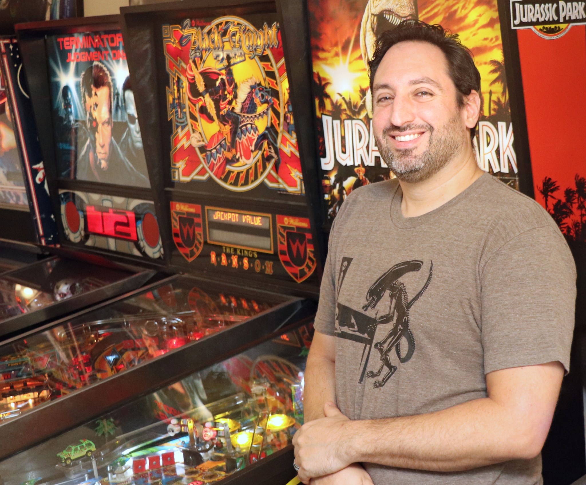 Andy Sokol near pinball machines.