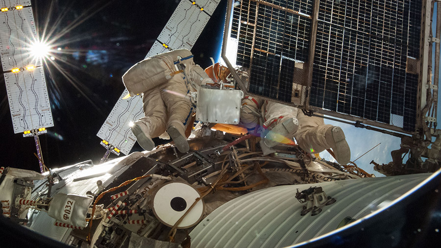 Cosmonauts Oleg Artemyev and Alexander Skvortsov are pictured during a spacewalk in 2014 outside the space station's Russian segment.