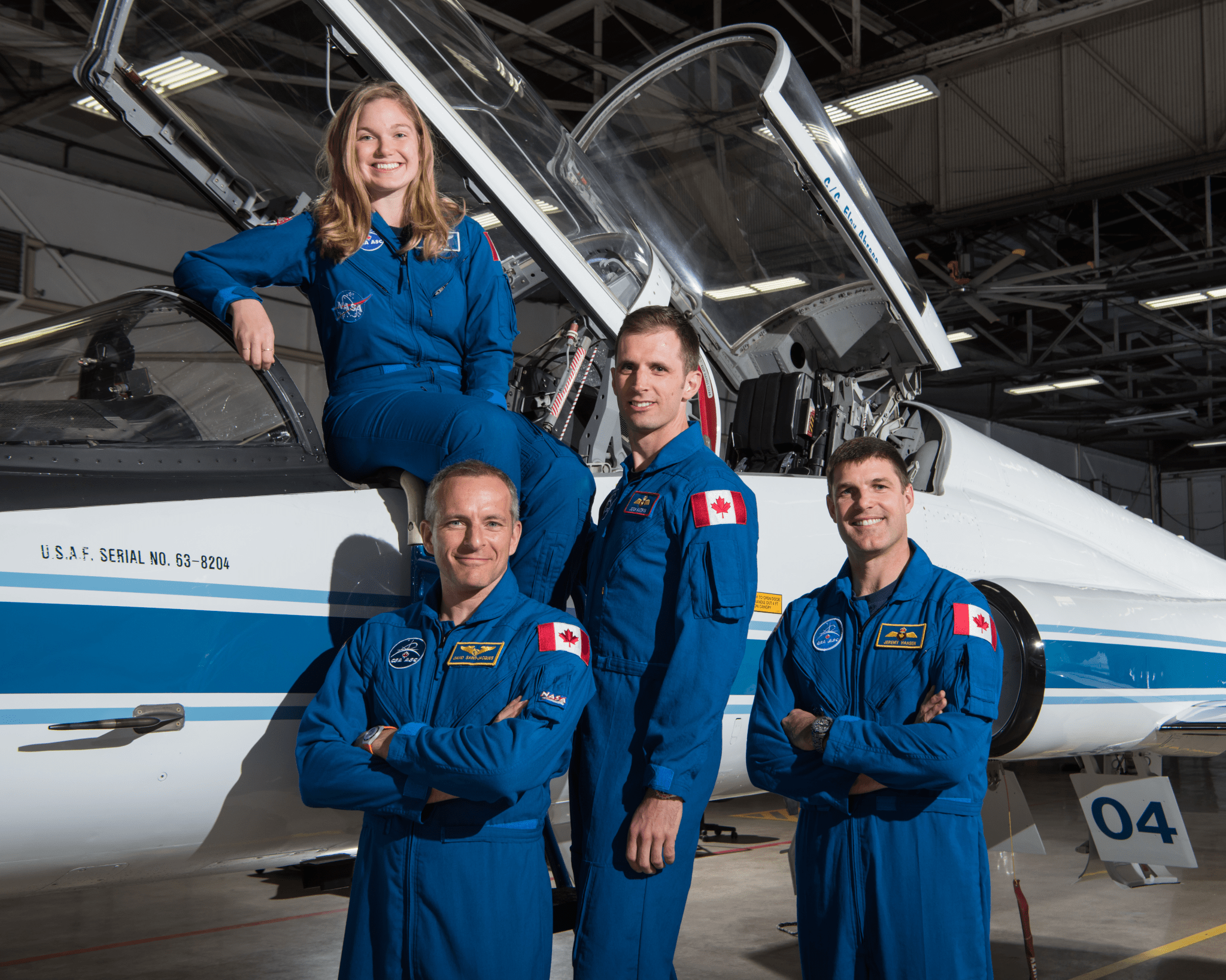 image of a group of astronauts near a plane