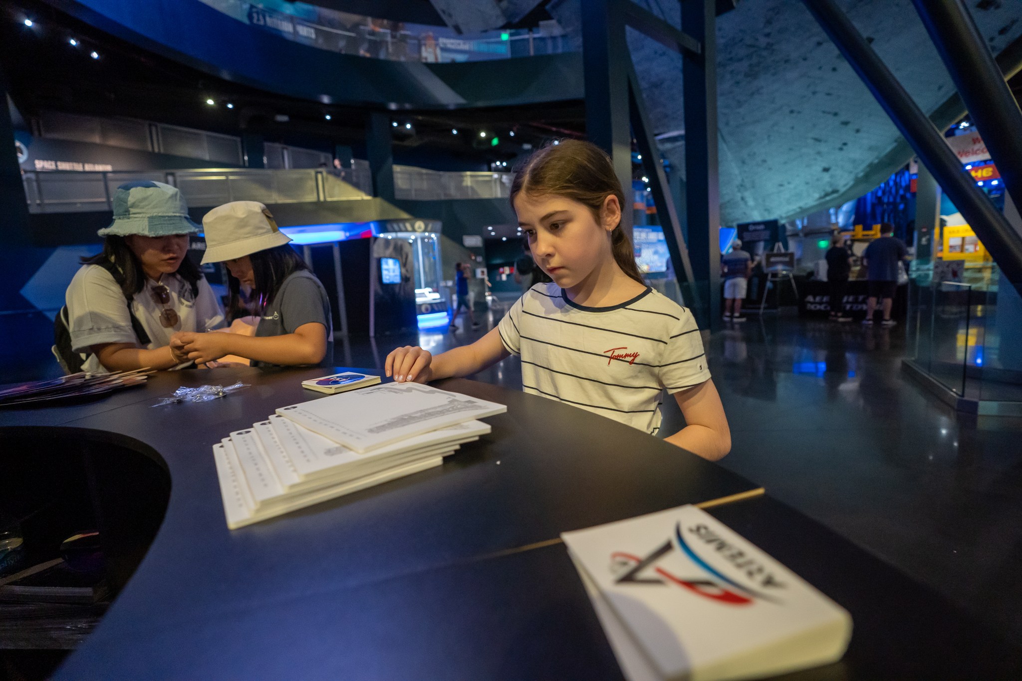 Guests visit the Space Launch System exhibit at the Kennedy Space Center Visitor Complex in Cape Canaveral, Florida. 