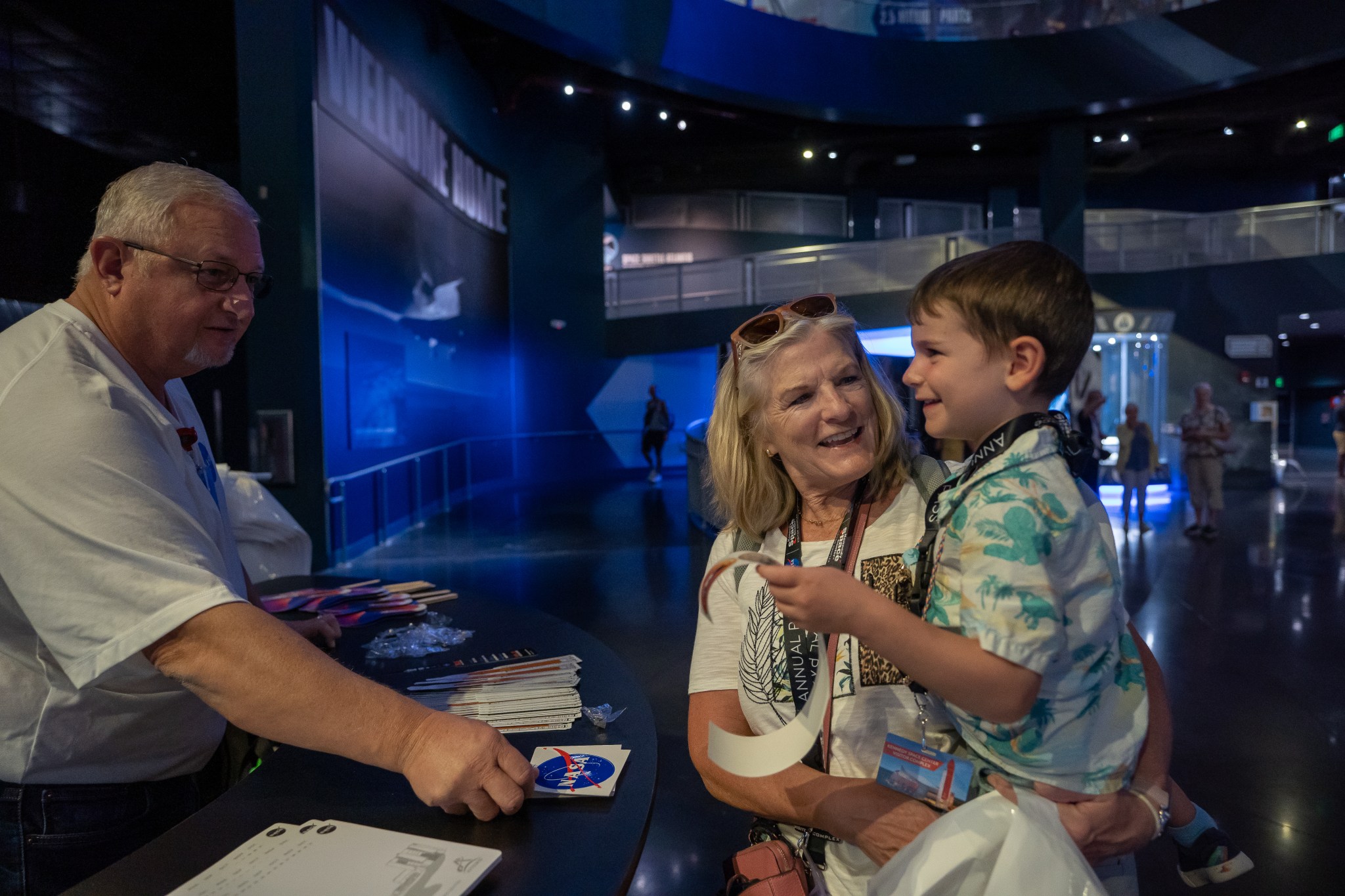 Guests visit the Space Launch System exhibit at the Kennedy Space Center Visitor Complex in Cape Canaveral, Florida. 