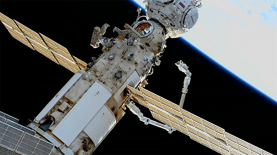 Spacewalkers Oleg Artemyev and Denis Matveev are pictured during a spacewalk on April 28, 2022, monitoring the station's new European robotic arm.