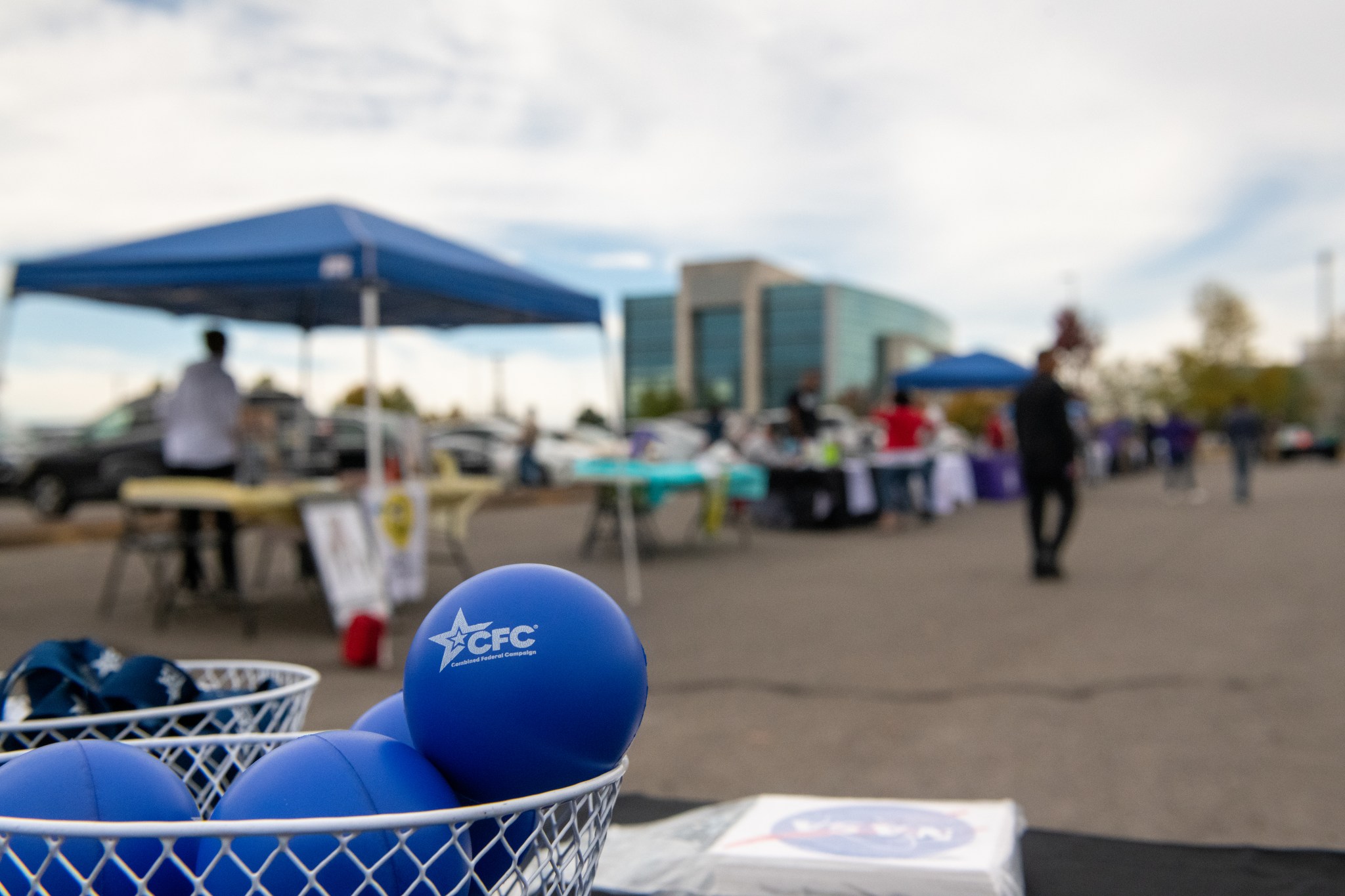 Attendees at the Food Truck Corral at Redstone Arsenal listen as Marshall Space Flight Center Director Jody Singer speaks during Marshall’s Combined Federal Campaign (CFC) kickoff and charity fair Oct. 25.