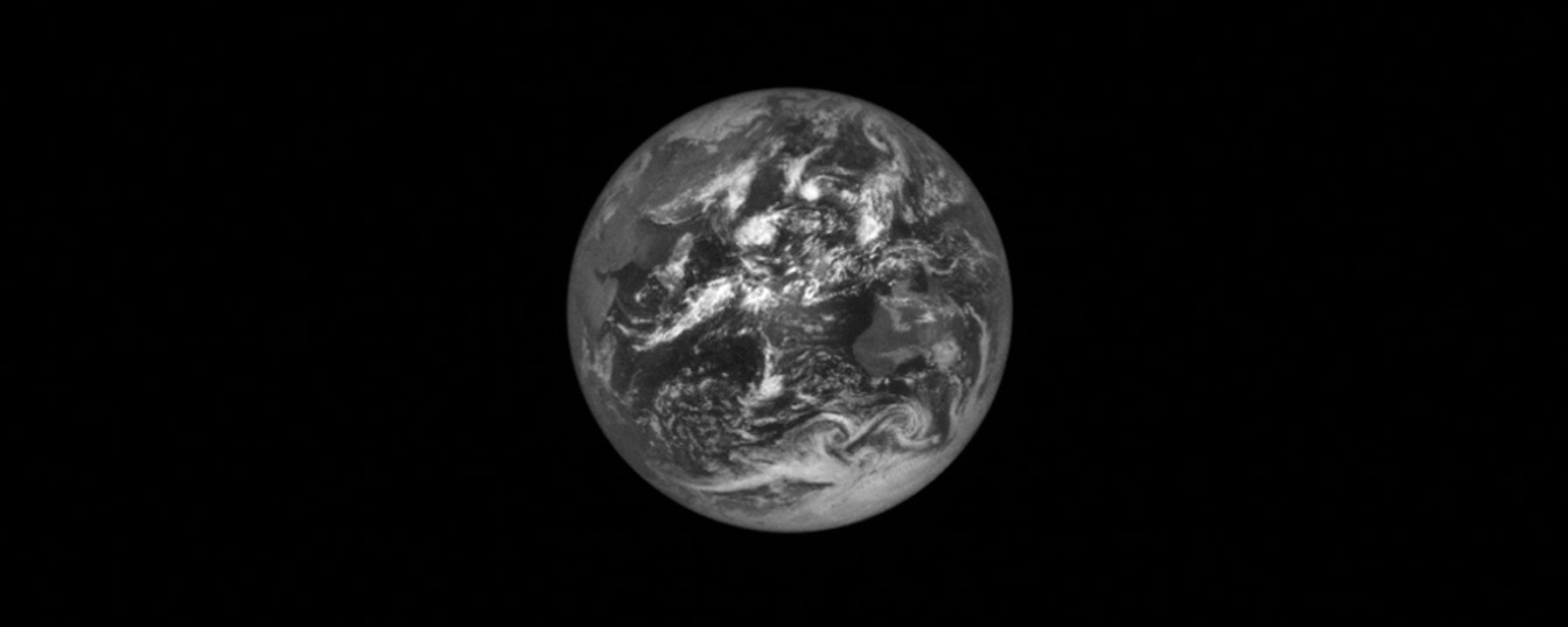 Black and White Photo of the Earth Taken from Lucy
