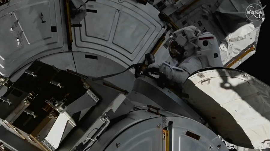 NASA Astronaut Josh Cassada enters the airlock at the end of Tuesdayâs spacewalk to prepare the station for upcoming solar array upgrades.