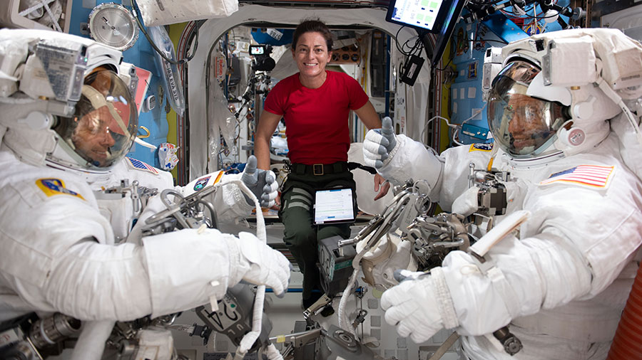 Astronaut Nicole Mann (center) assists astronauts Josh Cassada (left) and Frank Rubio (right), suited up in their Extravehicular Mobility Units (EMU), or spacesuits, before starting a spacewalk on Nov. 15, 2022.