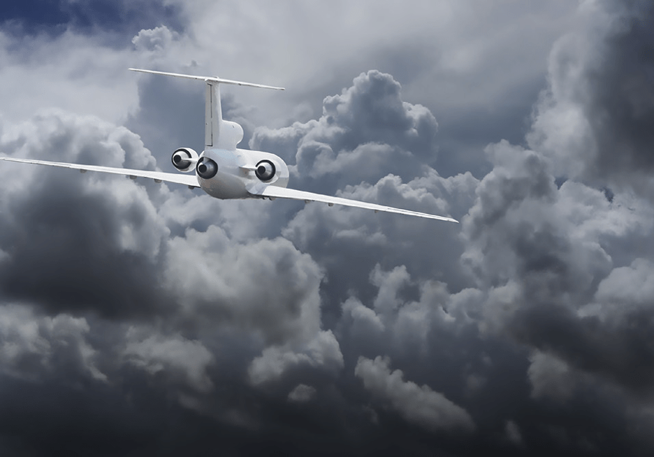 Airplane in cloudy sky