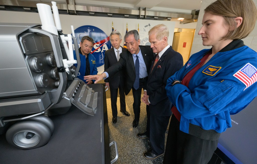 Japan Aerospace Exploration Agency (JAXA) astronaut Koichi Wakata, left, Japan’s Minister of Education, Culture, Sports, Science and Technology Masahito Moriyama, JAXA President Hiroshi Yamakawa, NASA Administrator Bill Nelson, and NASA astronaut Kayla Barron, right, talk by a model of the Pressurized lunar rover, after the signing of an historic agreement between the United States and Japan to advance sustainable human exploration of the Moon, Tuesday, April 9, 2024, at the NASA Headquarters Mary W. Jackson Building in Washington.