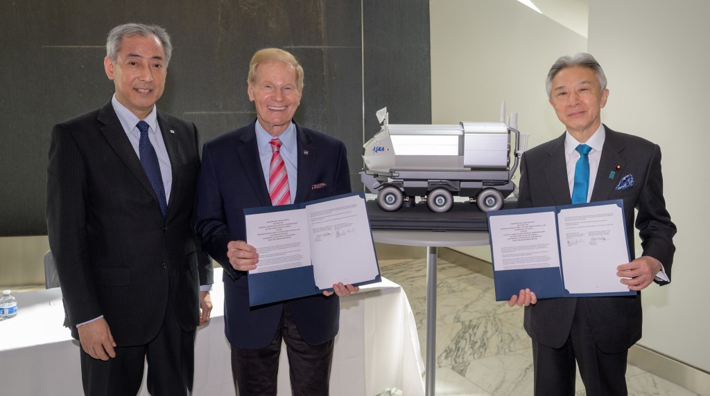 Japan Aerospace Exploration Agency (JAXA) President Hiroshi Yamakawa, left, NASA Administrator Bill Nelson, and Japan’s Minister of Education, Culture, Sports, Science and Technology Masahito Moriyama, right, pose for a group photograph holding the historic agreement signed April 9th at NASA Headquarters, between the United States and Japan to advance sustainable human exploration of the Moon, Wednesday, April 10, 2024, at the Japan Aerospace Exploration Agency (JAXA) offices in Washington.