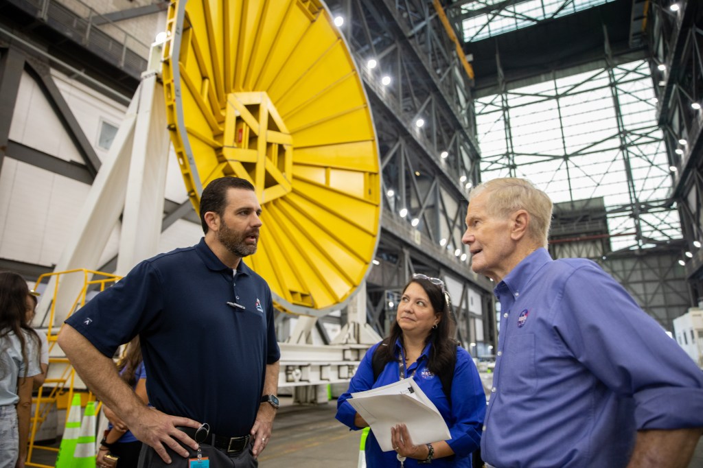 NASA Administrator Bill Nelson and NASA Exploration Ground Systems Program Deputy Manager Jeremy Parsons visit the agency’s SLS (Space Launch System) rocket core stage for the Artemis II mission inside NASA’s Kennedy Space Center in Florida on Thursday, Aug. 29, 2024.