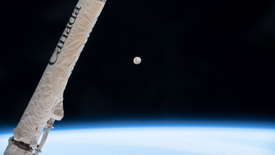 The waxing gibbous Moon is pictured above Earth's horizon as the space station orbited 271 miles over southern Argentina.