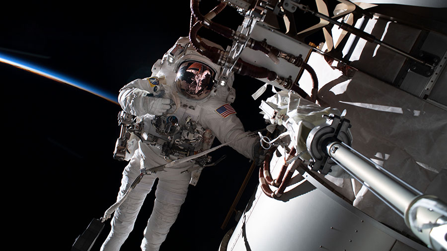 Astronaut Frank Rubio is pictured during a spacewalk on Nov. 15, 2022, tethered to the space station's starboard truss structure during an orbital sunset.