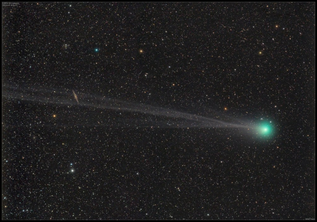 A green blur streaks across the black starry background from left to right.